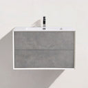 A modern wall-mounted bathroom vanity with two stone gray textured drawers, a white top and basin, and a black faucet, shown against a light neutral wall.
