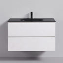 A modern 34-inch wall-mounted bathroom vanity with a matte black countertop and integrated sink, paired with a matte black faucet and two matte white drawers, shown against a neutral gray background.