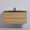 A modern wall-mounted 42-inch bathroom vanity with a light oak wood-grain cabinet, a matte black integrated sink top, and a matching matte black faucet, shown against a neutral light gray wall.