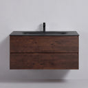 A modern floating 42-inch bathroom vanity with a matte black integrated sink and rich brown rose wood-grain cabinet, shown with two lower drawers pulled open against a light gray wall.