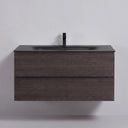 A modern floating 42-inch bathroom vanity with a graphite wood grain finish, featuring a built-in matte black rectangular sink and a matching matte black faucet, shown against a plain light gray wall.