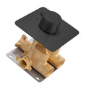A modern wall-mounted single-handle shower valve trim with a matte black square faceplate and cylindrical knob, paired with a polished brass valve body and a dark metal mounting plate, shown on a white background.