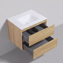 A floating 26-inch bathroom vanity with a matte white sink top, light oak wood cabinet, and two open gray drawers, shown against a light gray wall and floor.