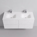 A modern matte white 52-inch double-sink wall-mounted bathroom vanity cabinet with four drawers and with two chrome faucets, shown against a light gray studio background.