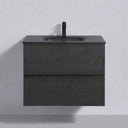 A floating 26-inch bathroom vanity with a dark charcoal black oak wood grain finish, featuring two drawers and an integrated sink with a matte black faucet, shown against a light gray wall.