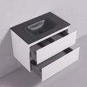 A modern 34-inch wall-mounted bathroom vanity with a matte black integrated sink and two matte white drawers, one of which is open to show the interior storage space.