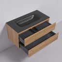 A modern wall-mounted 42-inch bathroom vanity with a matte black integrated sink and two open light oak wood drawers, shown against a light gray studio background.