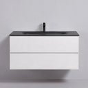 A modern wall-mounted 42-inch bathroom vanity with a matte white two-drawer cabinet and a matte black integrated sink top, paired with a black faucet, shown against a plain light gray wall.