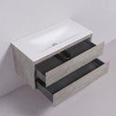A modern 42-inch wall-mounted bathroom vanity with a matte white integrated sink countertop, a light stone gray wood-grain cabinet, and two open dark gray drawers, shown against a light gray wall and floor.