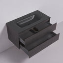 A black oak finish floating 42-inch bathroom vanity with a matte black rectangular basin and two open drawers, shown against a light gray wall and floor.