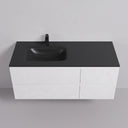 A modern matte white finish 52-inch wall-mounted bathroom vanity with a matte black countertop, integrated off center black basin, and a black faucet, set against a clean light gray wall and floor.