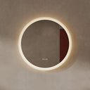 BAI 21011 modern minimalist round 30-inch bathroom vanity mirror with a glowing warm LED light ring, mounted on a textured beige plaster wall.