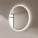 BAI 21012 modern minimalist round 36-inch bathroom vanity mirror with a glowing white LED light ring, mounted on a textured beige plaster wall side view.