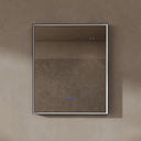 BAI 21021 modern rectangular 30-inch wall-mounted mirror with a slim LED light switched off and a black frame, shown against a textured beige wall. The mirror has small control touch sensor dots near the bottom center.