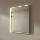 BAI 21021 modern rectangular 30-inch wall-mounted mirror with a slim warm LED light and a black frame, shown against a textured beige wall. The mirror has small control touch sensor dots near the bottom center.