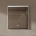 BAI 21022 modern rectangular 34-inch wall-mounted mirror with a slim white LED light and a black frame, shown against a textured beige wall. The mirror has small control touch sensor dots near the bottom center.