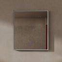 BAI 21022 modern rectangular 34-inch wall-mounted mirror with a slim LED light switched off and a black frame, shown against a textured beige wall. The mirror has small control touch sensor dots near the bottom center.