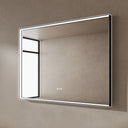 BAI 21024 modern rectangular 47-inch wall-mounted mirror with a slim white LED light and a black frame, shown against a textured beige wall. The mirror has small control touch sensor dots near the bottom center.