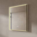 BAI 21031 modern rectangular 30-inch wall-mounted mirror with a slim warm LED light with gold frame, shown against a textured beige wall. The mirror has small control touch sensor dots near the bottom center.