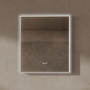 BAI 21032 modern rectangular 34-inch wall-mounted mirror with a slim white LED light with gold frame, shown against a textured beige wall. The mirror has small control touch sensor dots near the bottom center.