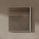 BAI 21032 modern rectangular 34-inch wall-mounted mirror with a slim LED light currently off with gold frame, shown against a textured beige wall. The mirror has small control touch sensor dots near the bottom center.