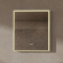 BAI 21032 modern rectangular 34-inch wall-mounted mirror with a slim warm LED light with gold frame, shown against a textured beige wall. The mirror has small control touch sensor dots near the bottom center.