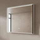BAI 21033 modern rectangular 40-inch wall-mounted mirror with a slim white LED light with gold frame, shown against a textured beige wall. The mirror has small control touch sensor dots near the bottom center.
