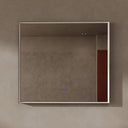 BAI 21033 modern rectangular 40-inch wall-mounted mirror with a slim LED light that's off with gold frame, shown against a textured beige wall. The mirror has small control touch sensor dots near the bottom center.