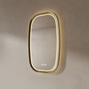 BAI 21041 modern oval wall-mounted vanity bathroom led mirror with a slim gold frame and integrated LED lighting, shown against a textured beige wall with front and side warm lighting.