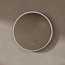BAI 21051 modern minimalist round 32-inch bathroom vanity mirror with a glowing white LED light ring and a gold frame, mounted on a textured beige plaster wall.
