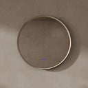 BAI 21051 modern minimalist round 32-inch bathroom vanity mirror with an LED light ring and a gold frame, mounted on a textured beige plaster wall.