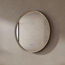 BAI 21051 modern minimalist round 32-inch bathroom vanity mirror with an LED light ring and a gold frame, mounted on a textured beige plaster wall.