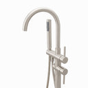 A modern freestanding bathtub faucet set in a brushed nickel finish, featuring a tall curved gooseneck spout, a vertical support column with a round base, a slide valve, and a handheld shower head with a flexible hose, shown on a plain white background.