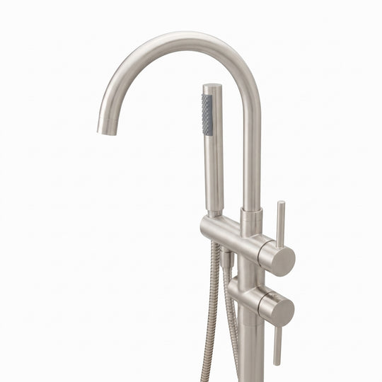 A modern freestanding bathtub faucet set in a brushed nickel finish, featuring a tall curved gooseneck spout, a vertical support column with a round base, a slide valve, and a handheld shower head with a flexible hose, shown on a plain white background.
