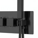Close-up of a matte black wall-mounted thermostatic shower system from BAI with two square controls, a vertical shower head, and two flexible hoses on a white background.
