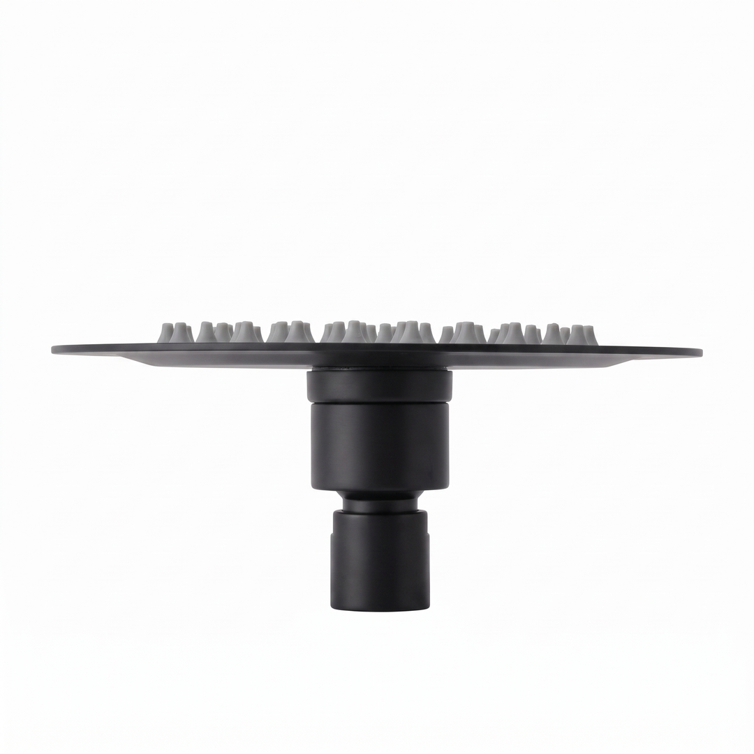 A matte black 6-inch rainfall shower head with a circular head featuring multiple small gray silicone nozzles and a cylindrical neck, shown against a plain white background.