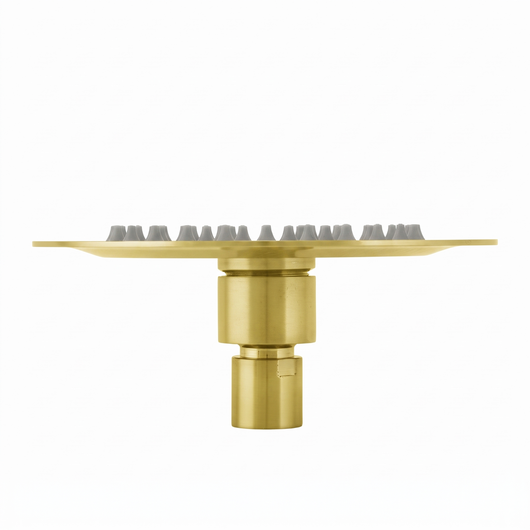 BAI 42003 round brushed gold 6-inch shower head plate with multiple small gray silicone nozzles arranged in concentric circles, shown on a plain white background.