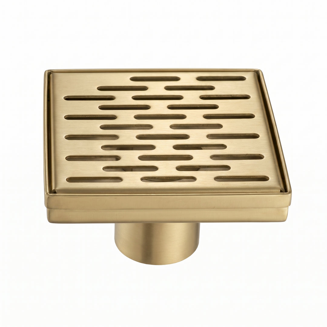 A square brushed gold shower drain cover with horizontal slotted grates and a cylindrical base, shown on a plain white background.