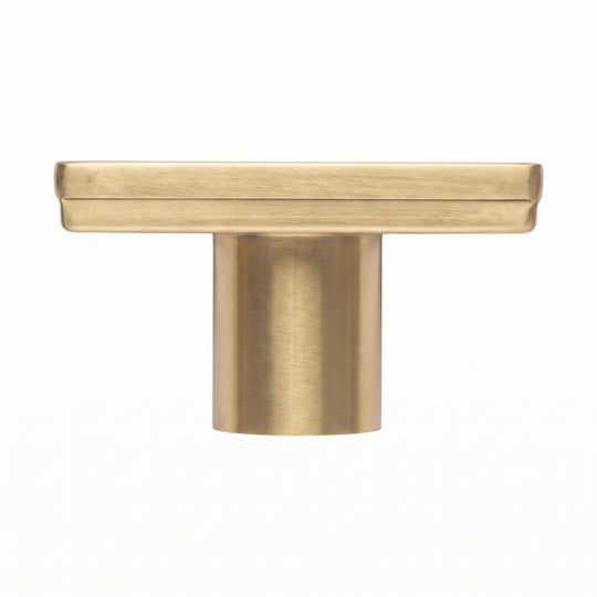 A square shower drain with a brushed gold finish, shown from the side on a solid white background.