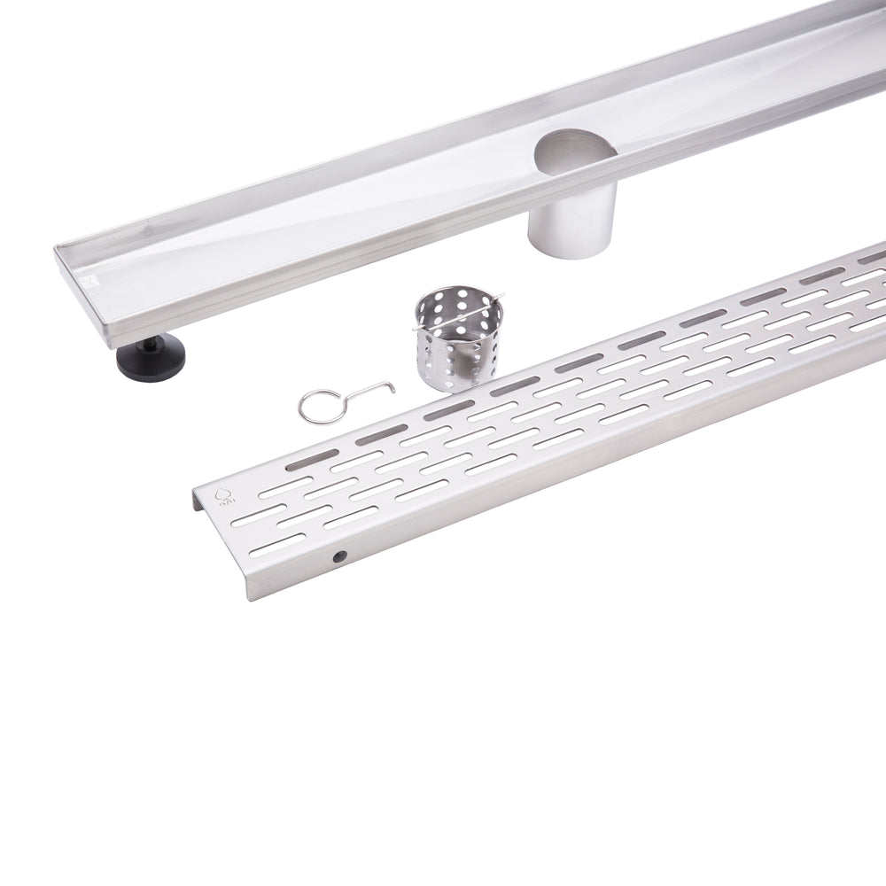 A stainless steel outdoor shower drain channel kit with a long channel trough, a perforated drain grate, a mounting bracket, a small metal cup, and a small hook, displayed on a clean white background.