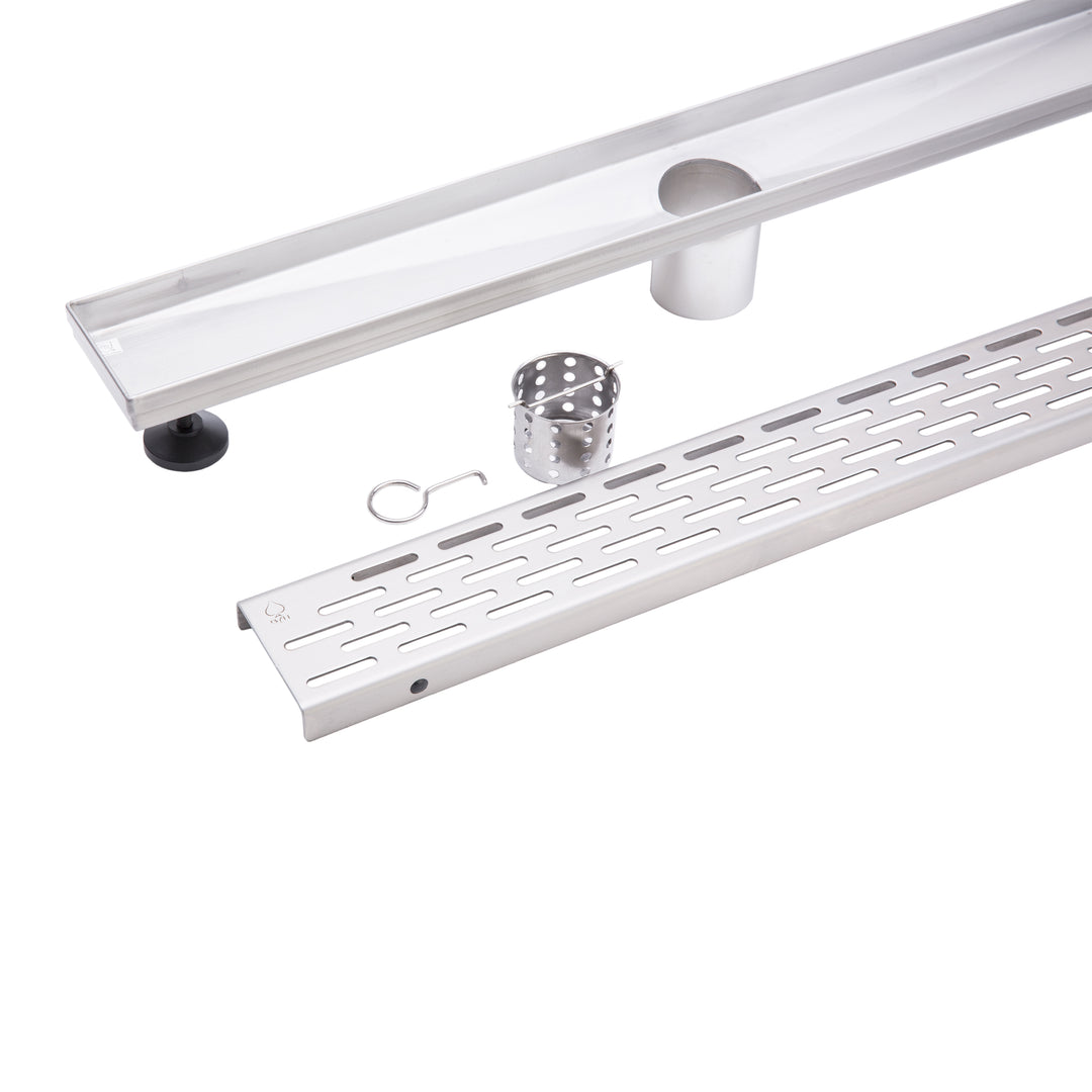 A stainless steel outdoor shower drain channel kit with a long channel trough, a perforated drain grate, a mounting bracket, a small metal cup, and a small hook, displayed on a clean white background.
