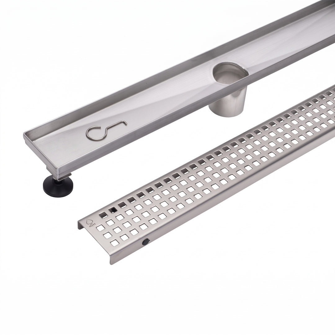 A stainless steel linear channel drain with a slotted grate section and a circular opening, shown on a clean white background.