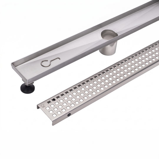 A stainless steel linear channel drain with a slotted grate section and a circular opening, shown on a clean white background.