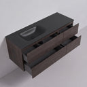 A modern floating 52-ich bathroom vanity with a matte black countertop and off centered integrated sink, paired with dark brown graphite wood-grain drawers, shown with two lower drawers pulled open against a light gray background.