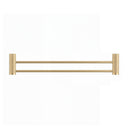 A modern wall-mounted double towel bar in brushed gold with textured cylindrical wall mounts on either end, shown against a plain white background.