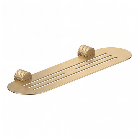A modern transitional brushed gold wall-mounted bathroom shelf with two knurled hook holders on a solid white background.