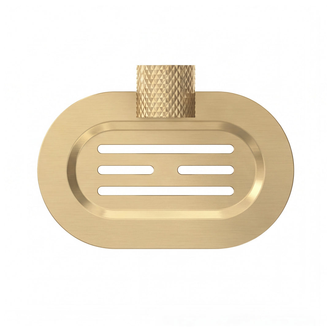 A modern wall-mounted brushed gold metal oval soap dish with a textured, diamond-patterned hanger, shown on a clean white background.